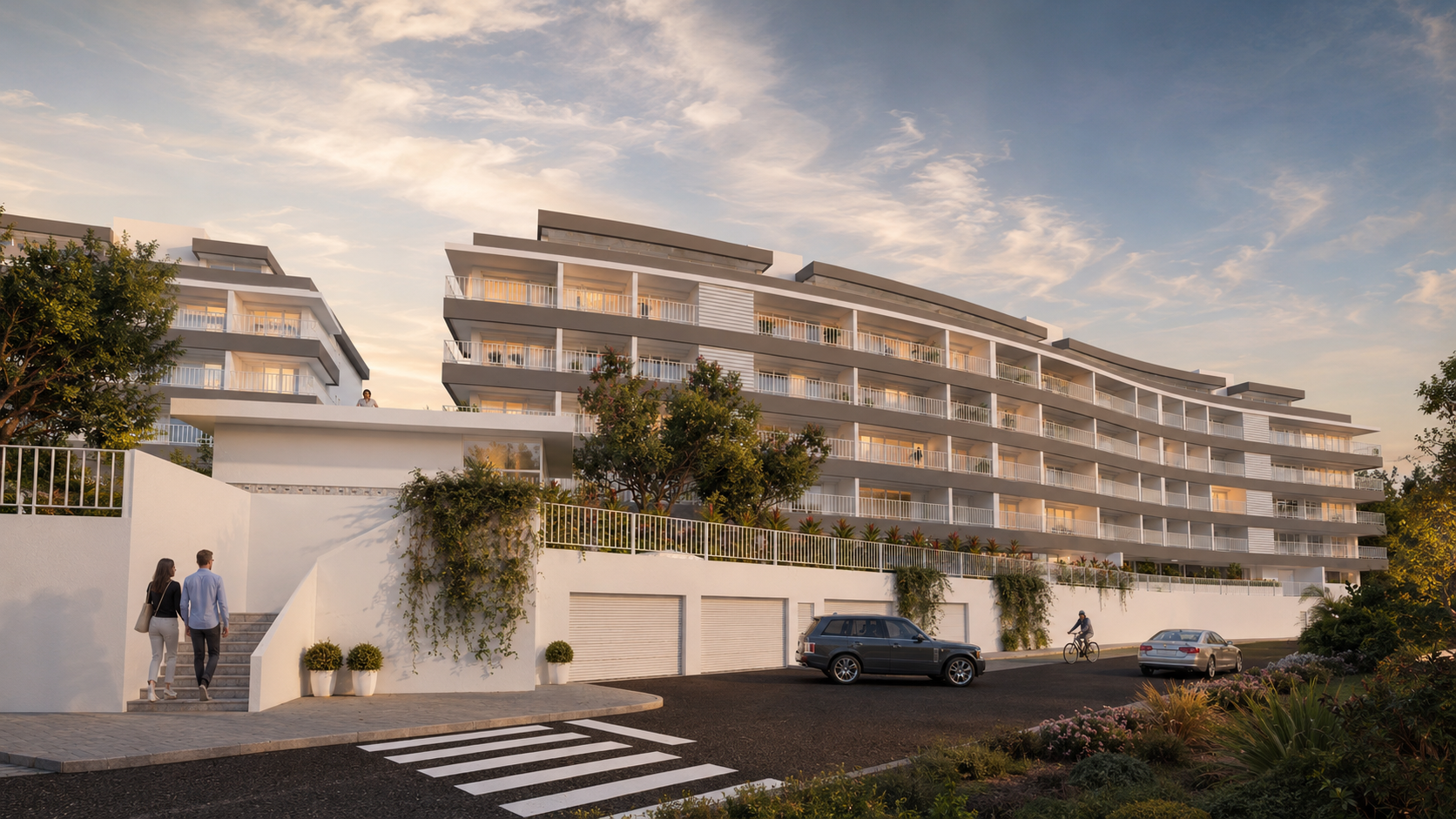 Fachada curva de empreendimento residencial ao pôr do sol